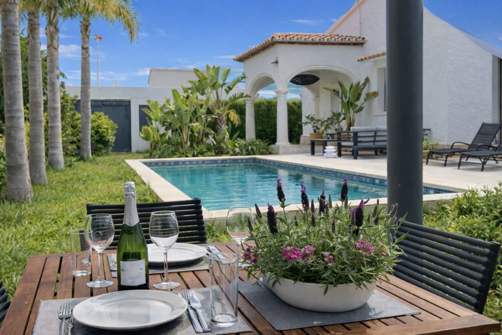 Pergola dining area by the pool