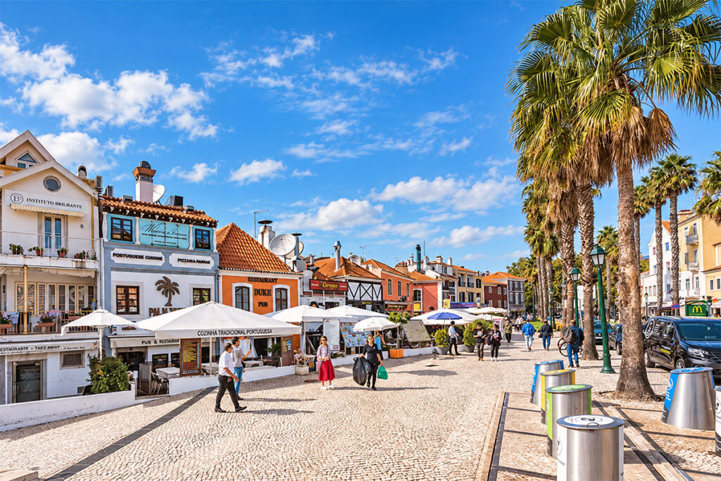 A palm-lined street of cafés and restaurants in central Cascais