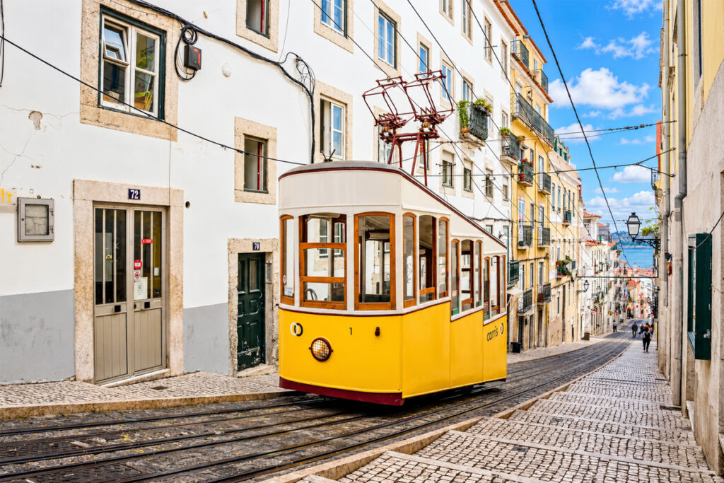 A yellow funicular climbing one of the steep streets near Chiado