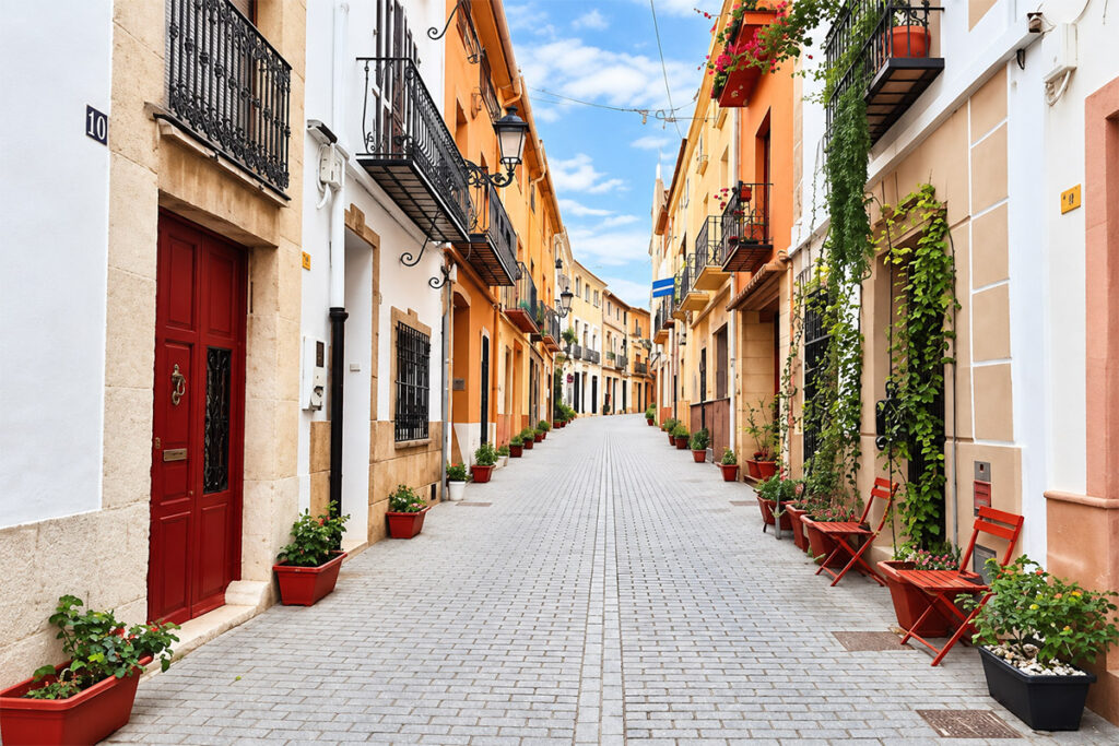 A quiet street in Moraira's old centre, potted flowers on the doorsteps
