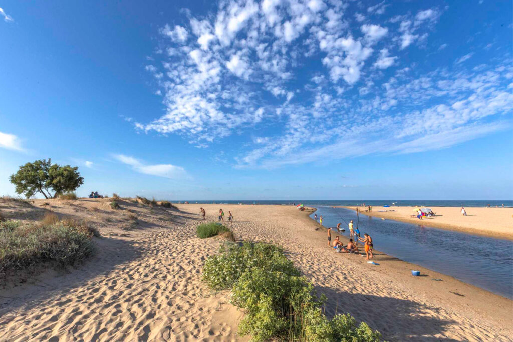The wide sandy beach and inlet at Les Marines, Dénia