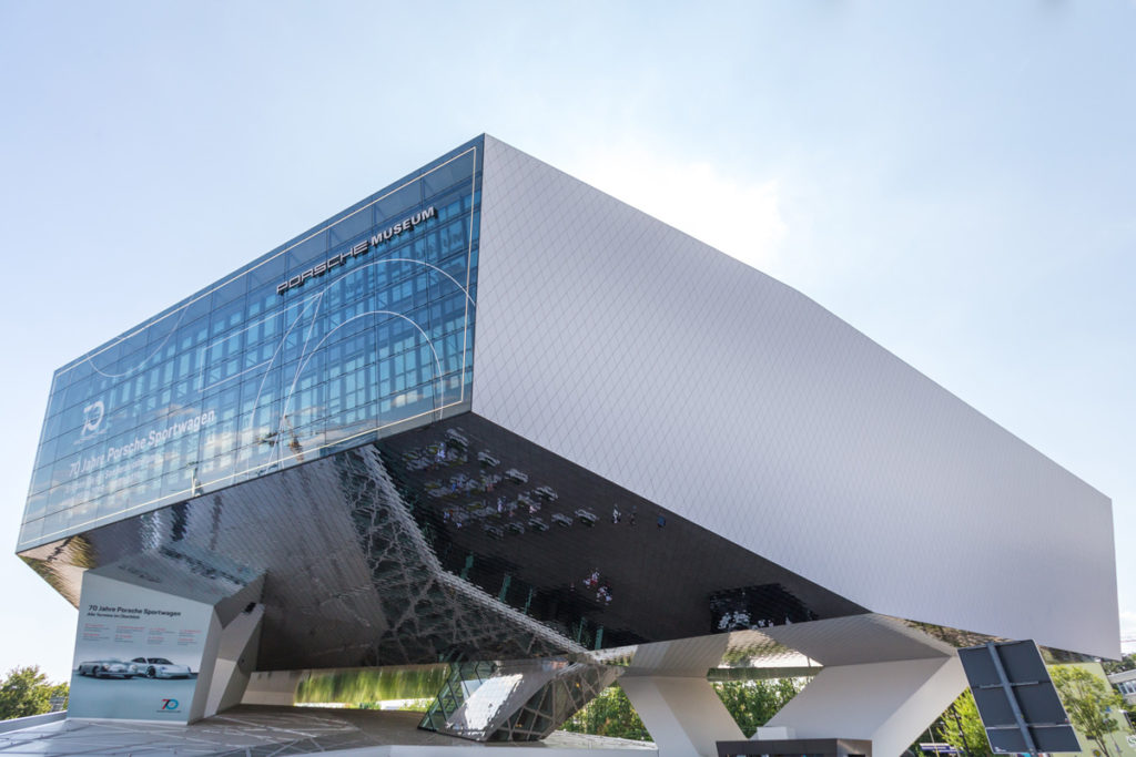 The Porsche Museum, a white block cantilevered on angled columns, in Zuffenhausen