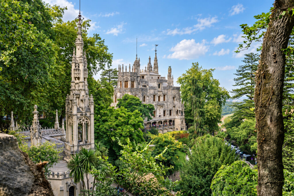 The neo-Gothic Quinta da Regaleira seen through the trees