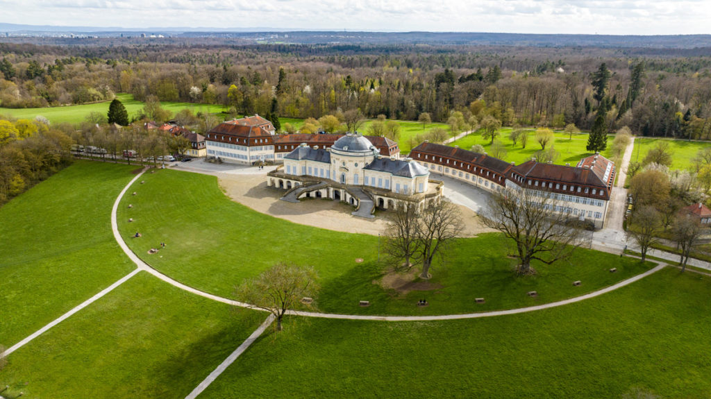 Aerial view of Schloss Solitude on its wooded ridge, with Stuttgart on the horizon