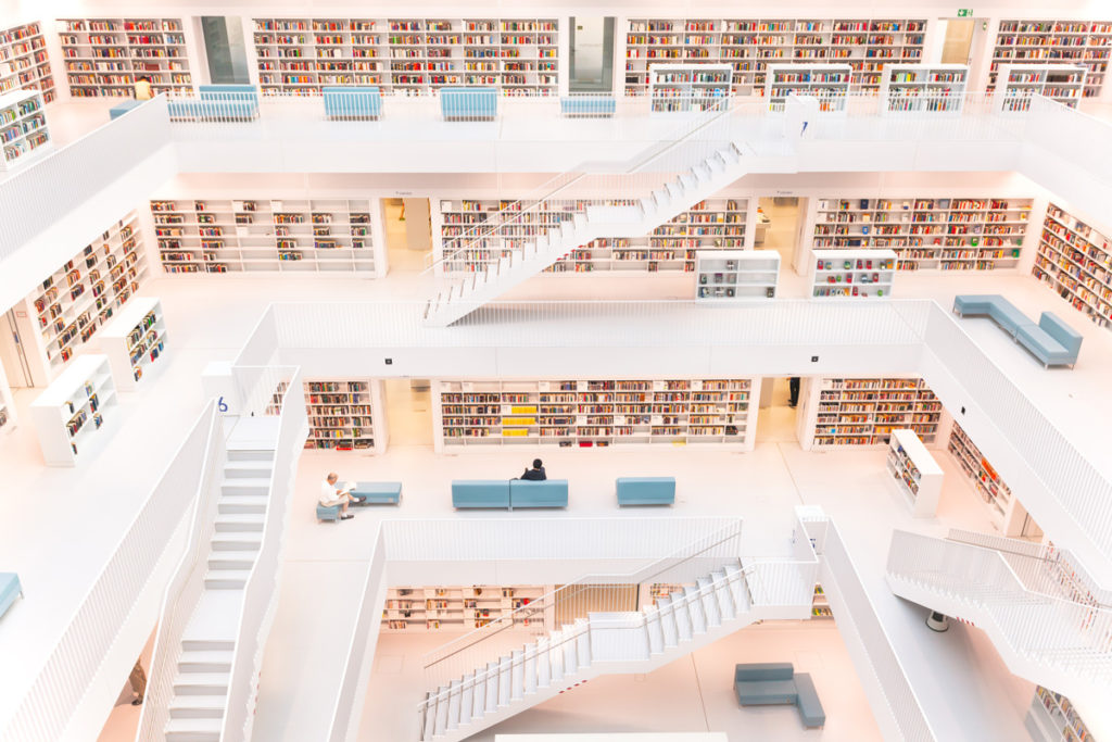 The white central hall of the Stuttgart Stadtbibliothek, with its galleried floors of books